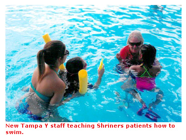 New Tampa Y staff teaching Shriners patients how to swim.